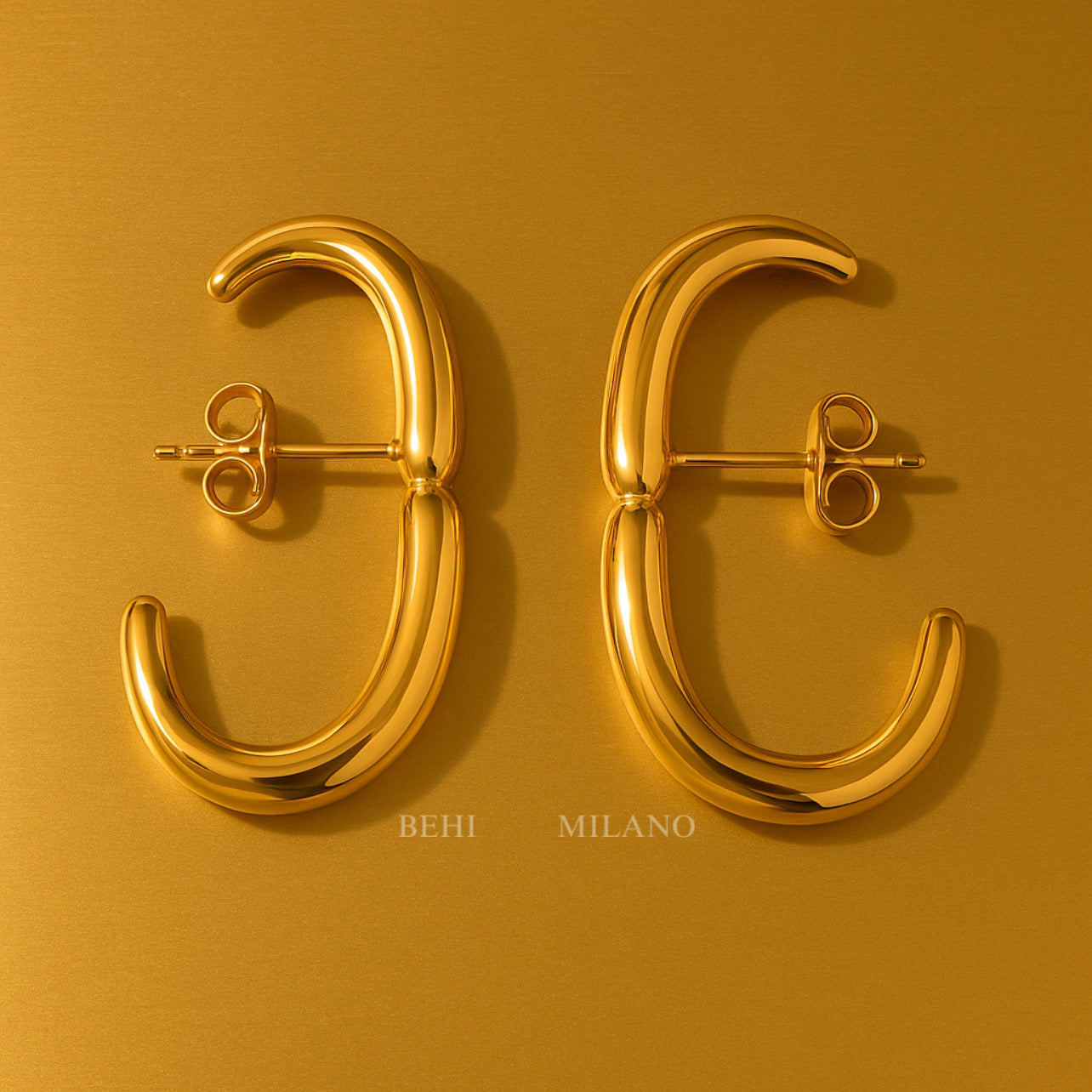 The BEHI Petra Earrings on a minimal background, highlighting the durable, waterproof gold surface.