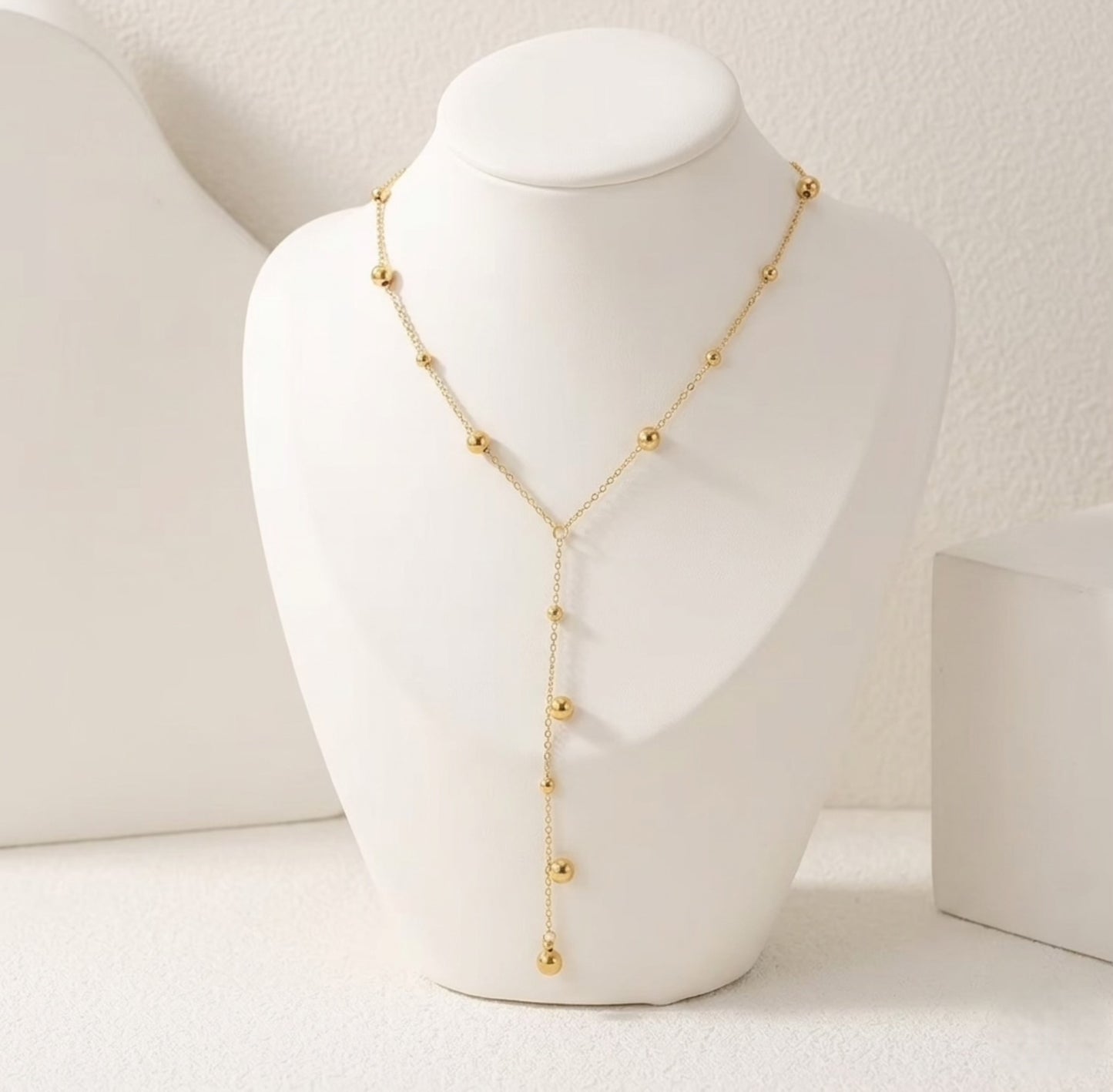 An angled perspective of the BEHI Rovena Necklace, showcasing the durable, high-shine 18k PVD gold plating.