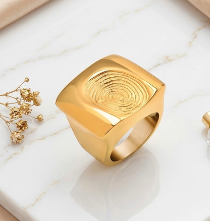 BEHI SIGNATURE 18k PVD gold-plated hypoallergenic fingerprint ring with a textured surface.