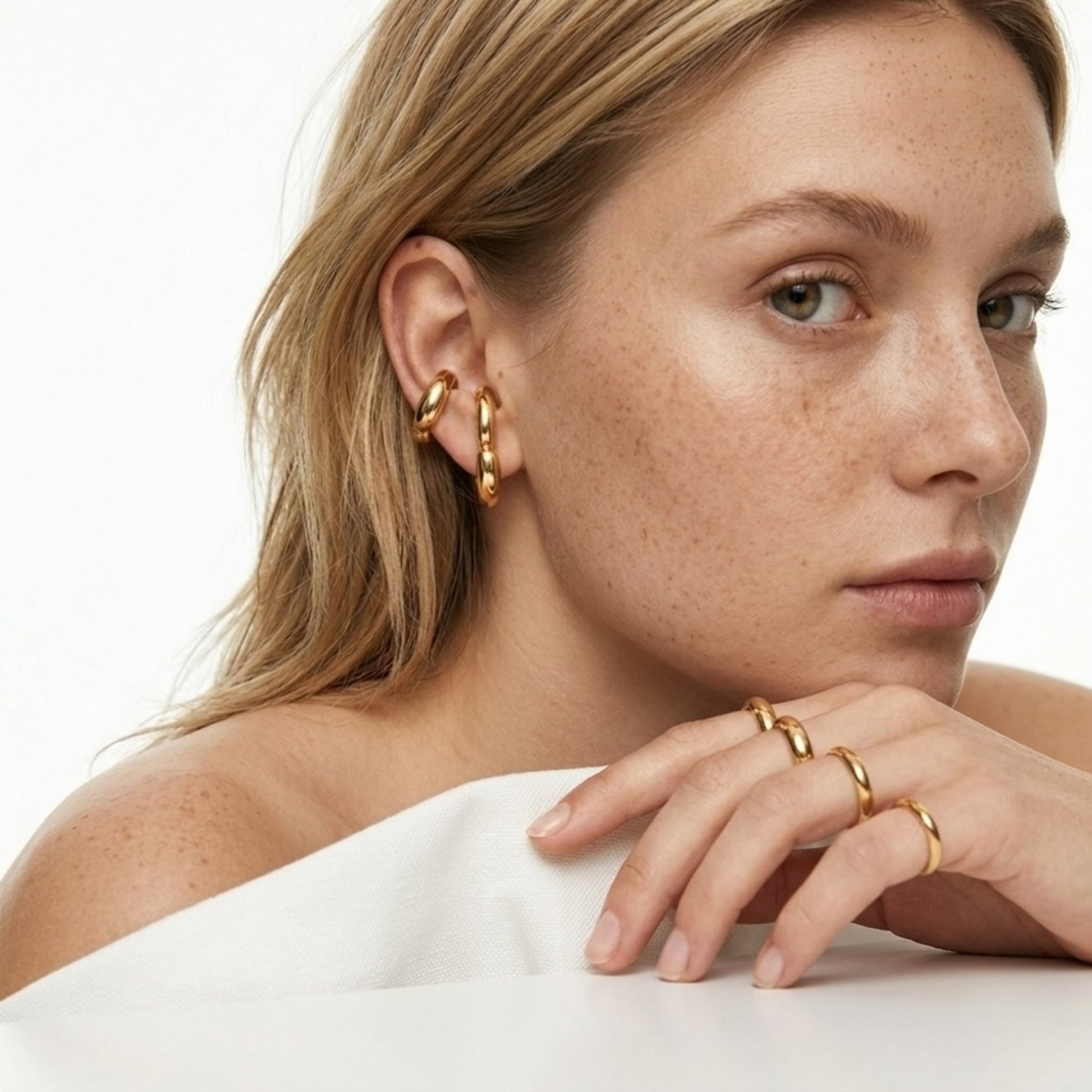 A profile view of the waterproof BEHI Petra Earrings, featuring a bold, tarnish-free design.
