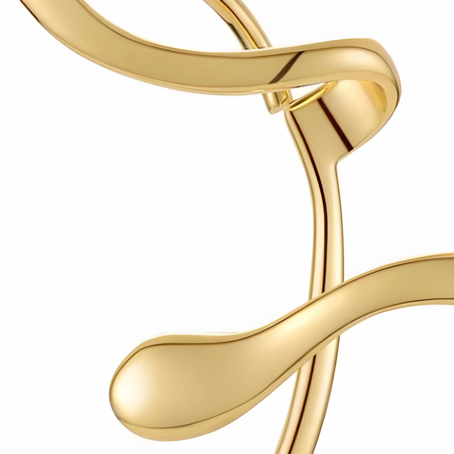 Close-up detail of BEHI MILANO Afrodite Ear Cuffs gold — sculptural wrap shape, PVD-coated brass, tarnish-free hypoallergenic ear cuff