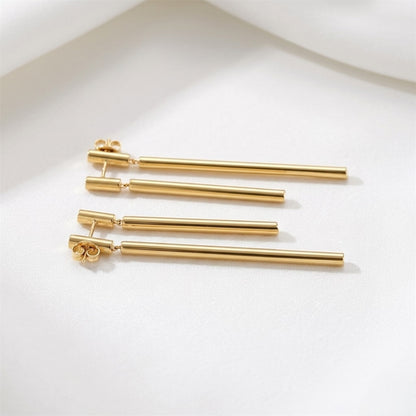 BEHI Deffi Earrings in gold displayed on a minimal surface, emphasizing their durable, tarnish-free high-polish shine.