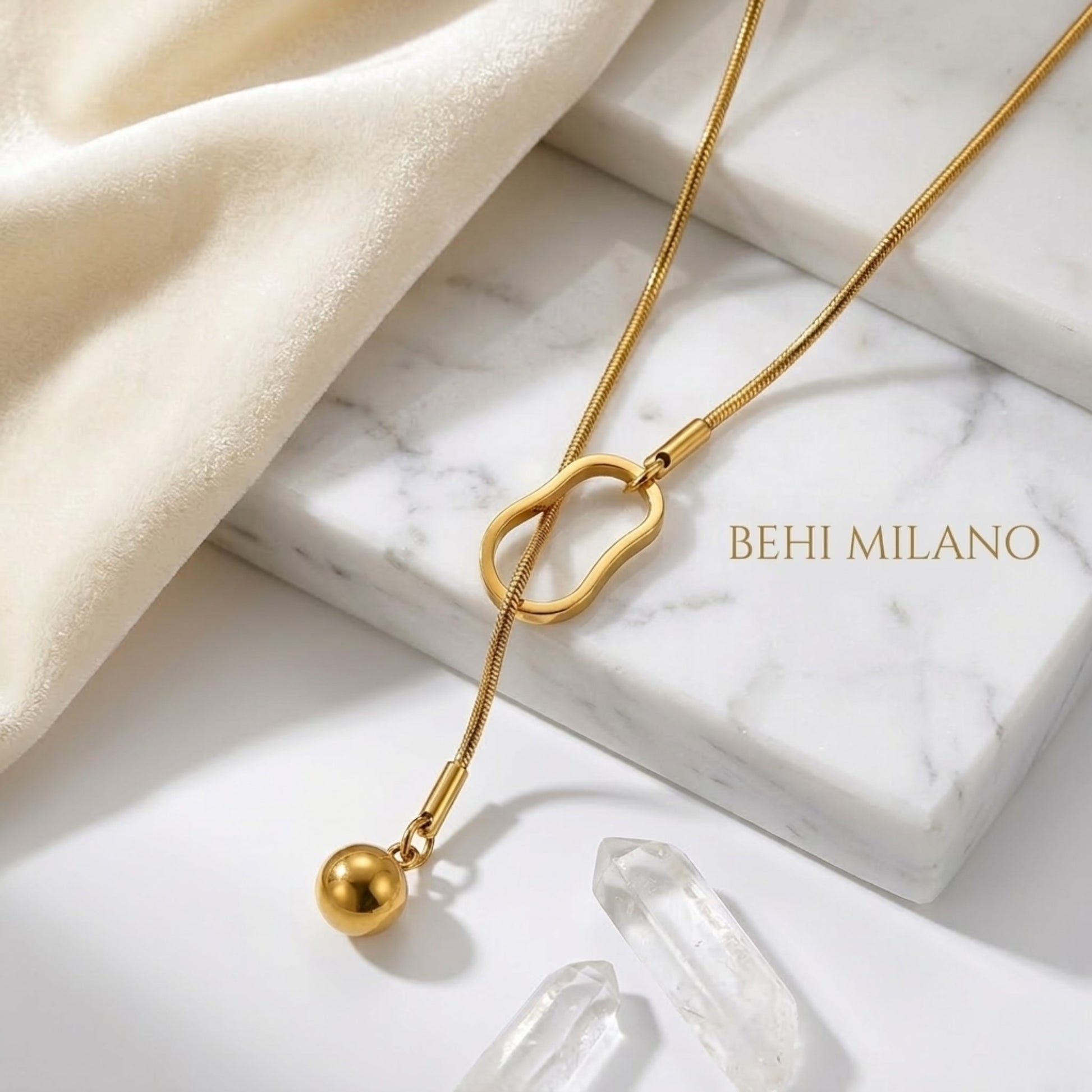BEHI Temwoo Necklace displayed on a minimal surface, emphasizing the tarnish-free durability of the 18k gold plating.
