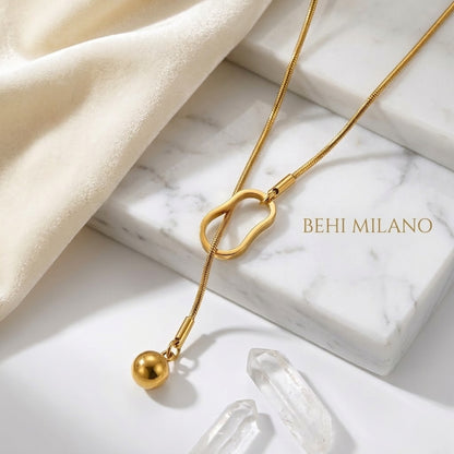 BEHI Temwoo Necklace displayed on a minimal surface, emphasizing the tarnish-free durability of the 18k gold plating.
