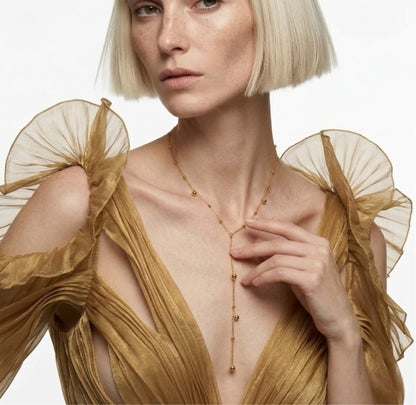 BEHI Rovena Necklace worn on a model to showcase the elegant lariat drop and tarnish-free 18k gold finish.