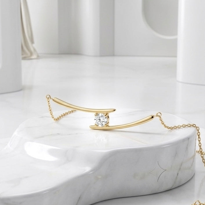 BEHI Alison Necklace on a clean minimalist surface, demonstrating how the gold-plated bar catches the light.