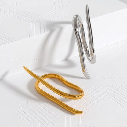 BEHI DAISY 18k PVD gold-plated, fashion and asymmetric double finger ring with a smooth, polished finish.