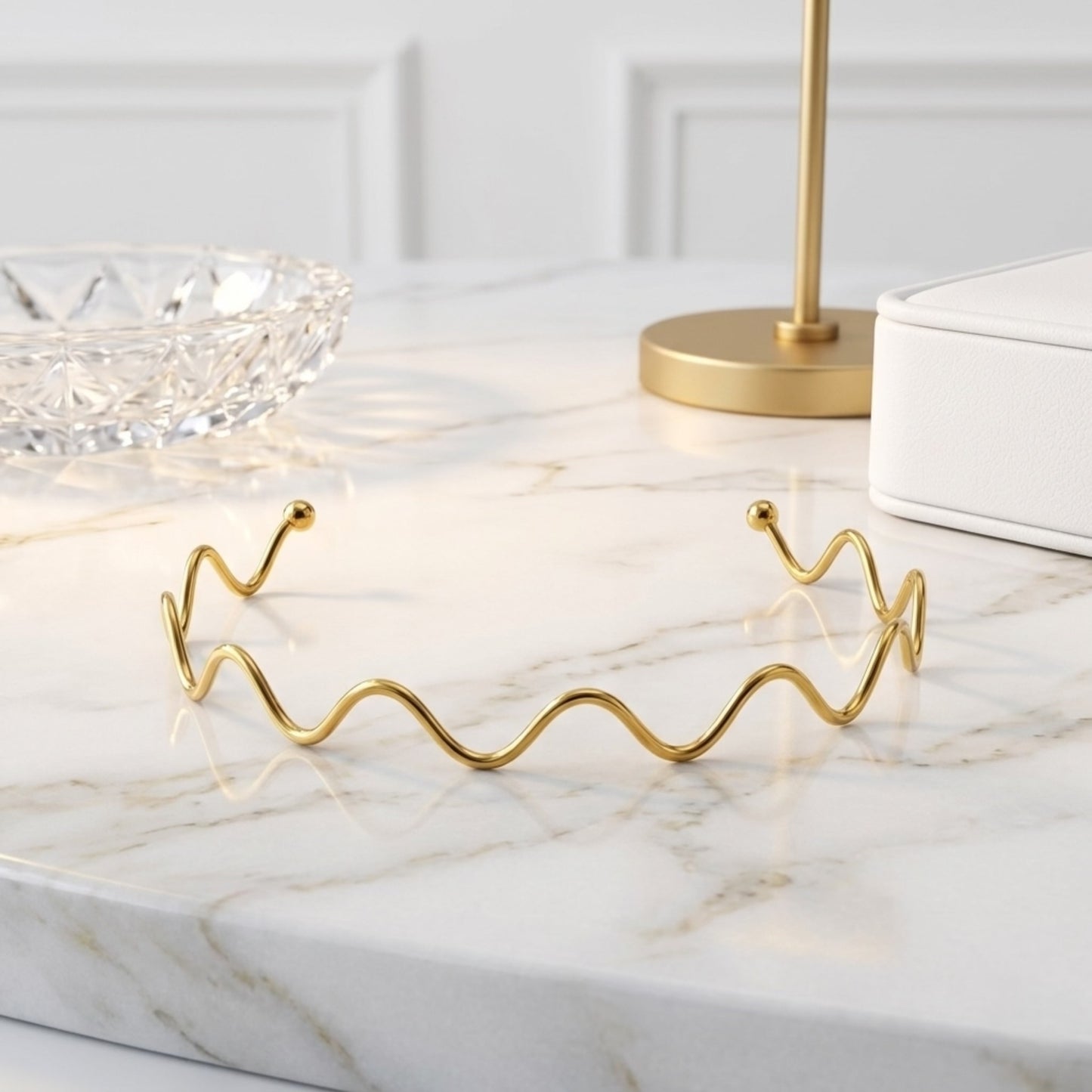 BEHI Carla Choker displayed on a minimal pedestal, emphasizing the durable and waterproof gold-plated construction.