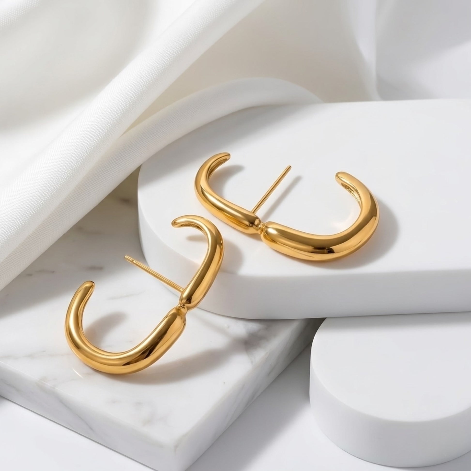 Macro view of the BEHI Petra Earrings, showing the smooth finish of the tarnish-free, waterproof gold.