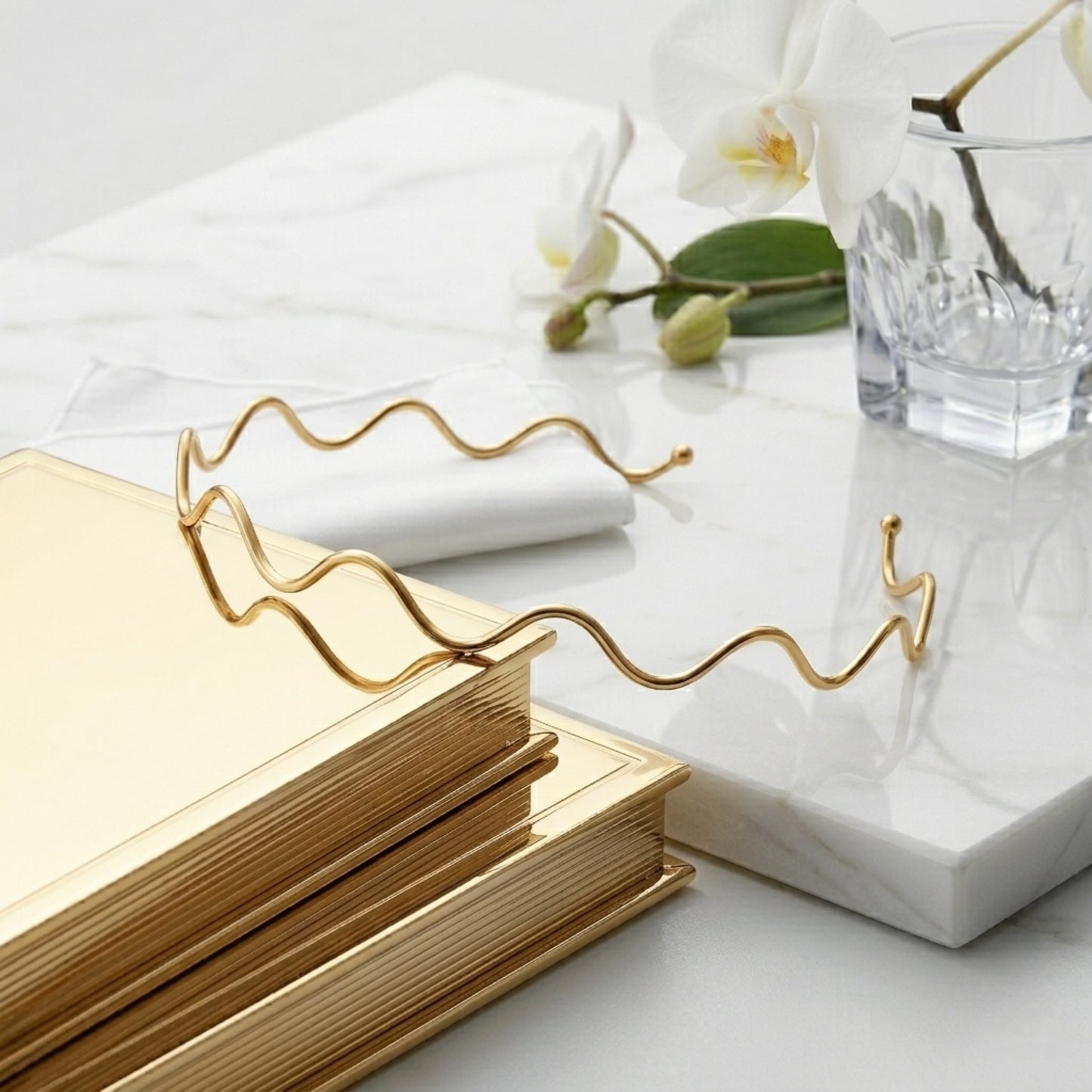 The BEHI Carla Choker shown with luxury branded packaging, showcasing its sculptural, tarnish-free design.