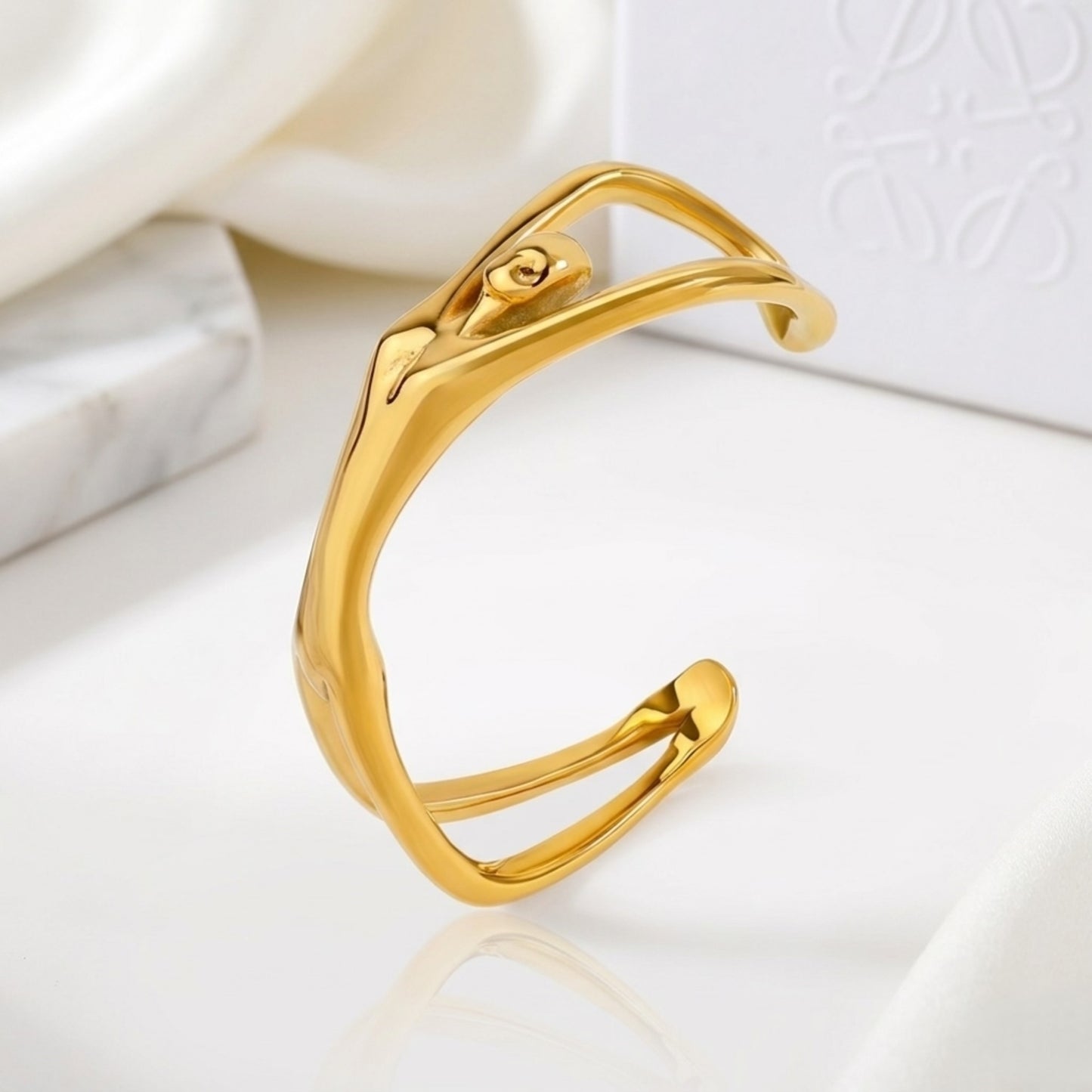 BEHI Devika Slim Bracelet | 18k PVD gold-plated stainless steel cuff bracelet with an abstract woman body design | Waterproof, Hypoallergenic and tarnish-free | Shiny gold finish
