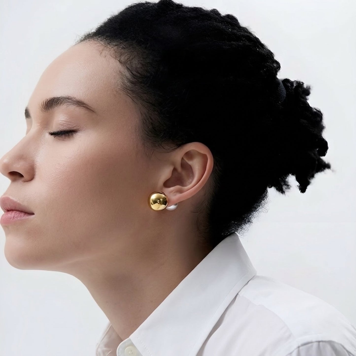 BEHI ROWA earrings featuring a 18k PVD gold plated stainless steel small sphere with an imitation pearl piece