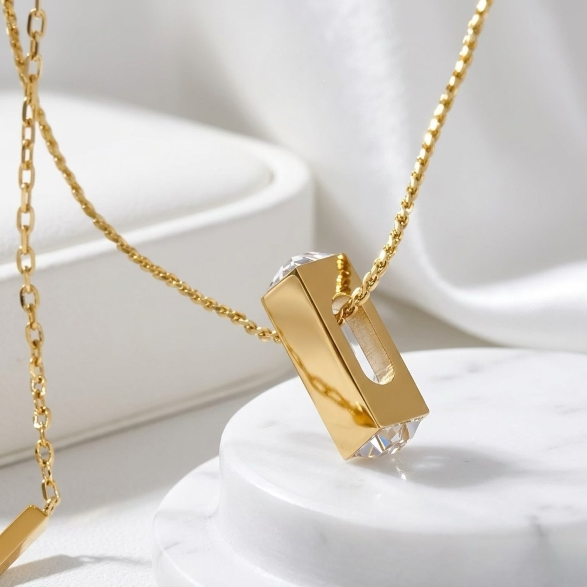 BEHI Zoey Necklace | 18k PVD gold plated  stainless steel minimal necklace with a rectangular pendant and clear Zircon gemstones at the top and bottom | Waterproof, Hypoallergenic and tarnish-free
