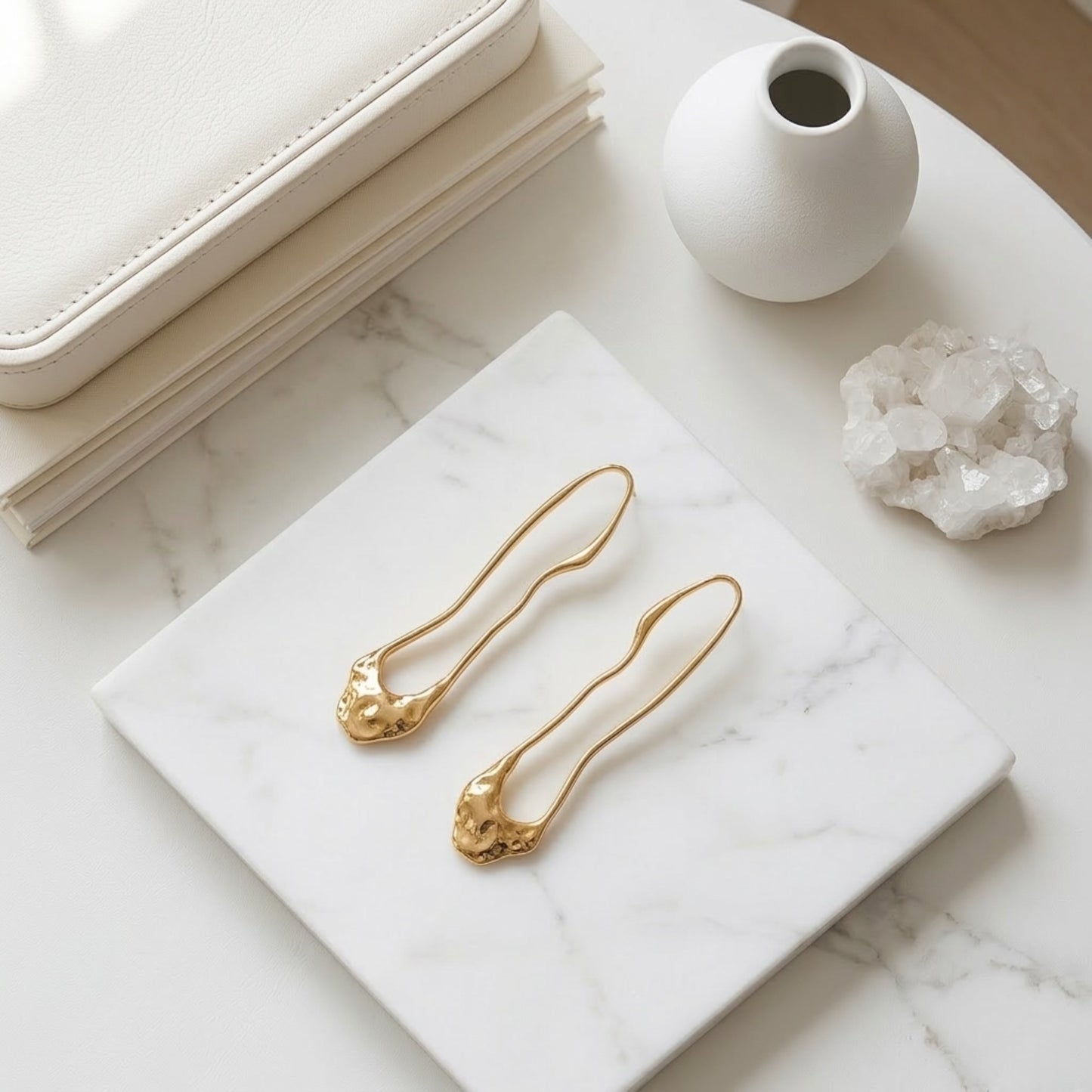 BEHI TRINI 18k PVD gold-plated waterproof stainless steel earrings with an elongated organic shape in shiny gold finish.