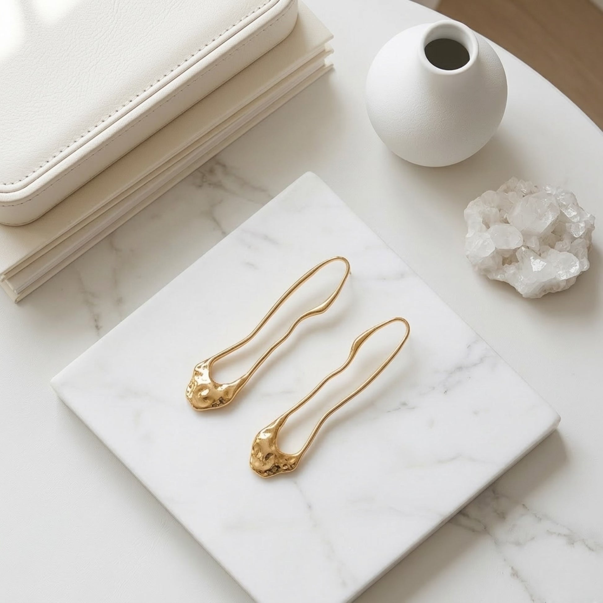 BEHI TRINI 18k PVD gold-plated waterproof stainless steel earrings with an elongated organic shape in shiny gold finish.