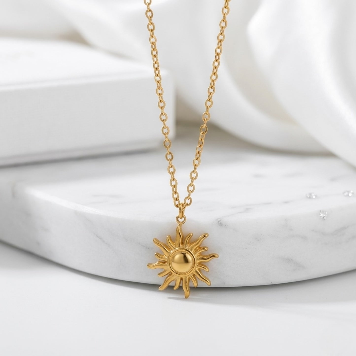 BEHI LOVE SUN Necklace displayed on a minimal surface, emphasizing the high-quality, tarnish-resistant plating.
