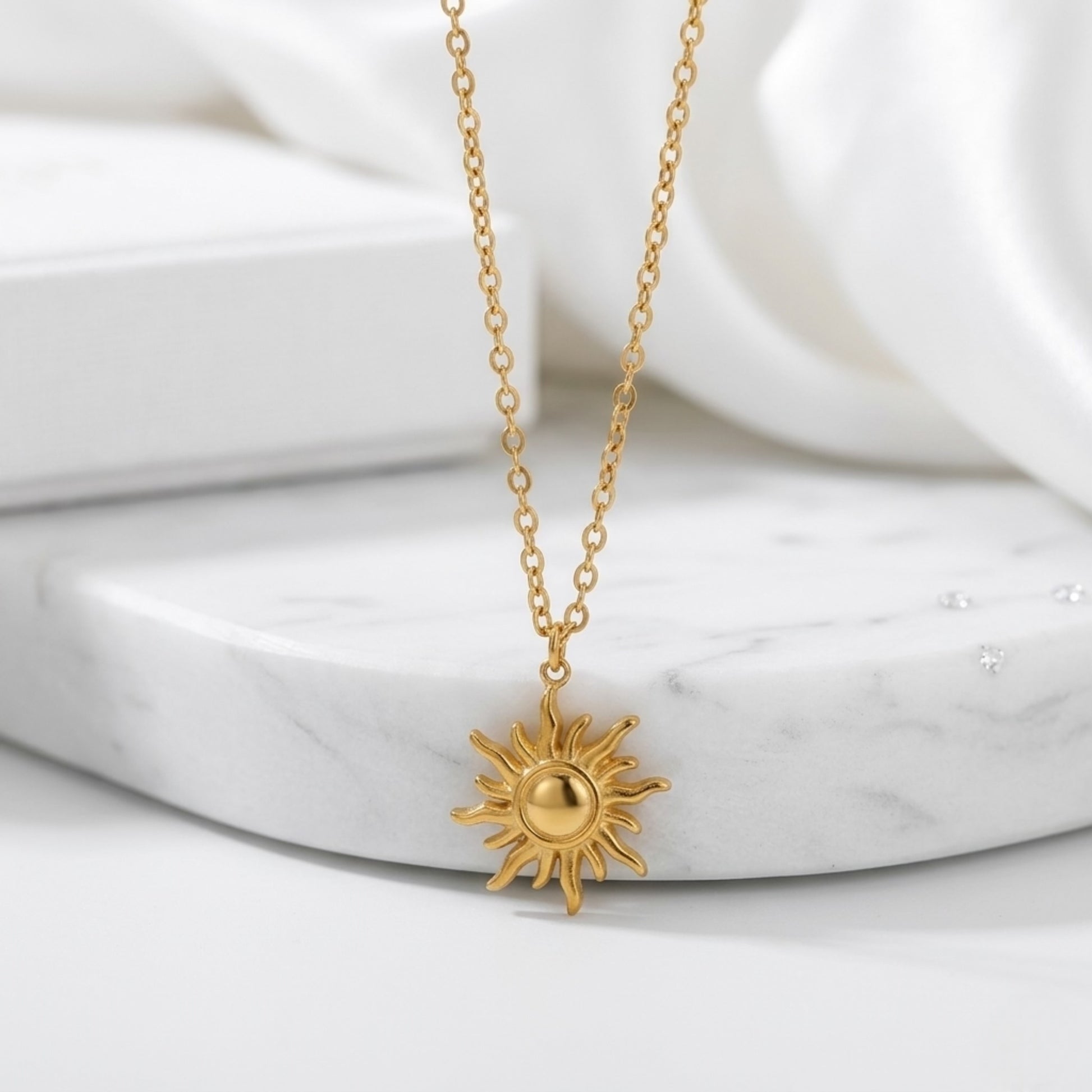 BEHI LOVE SUN Necklace displayed on a minimal surface, emphasizing the high-quality, tarnish-resistant plating.
