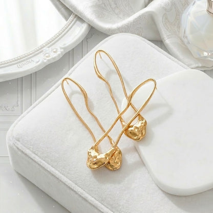 BEHI TRINI 18k PVD gold-plated stainless steel earrings with an elongated organic shape Italian design in shiny gold finish.