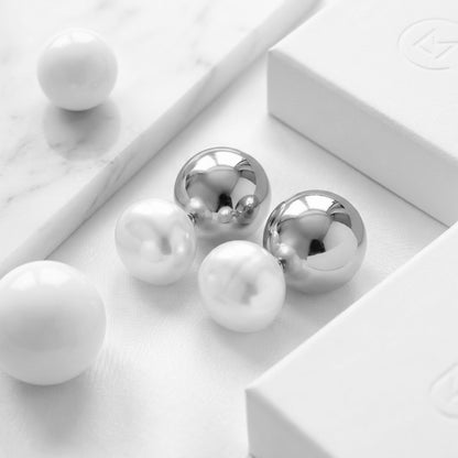 BEHI ROWA earrings featuring a 18k PVD gold plated small shiny silver sphere with an imitation pearl piece minimal design