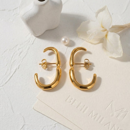 The BEHI Petra Earrings on a minimal background, highlighting the durable, waterproof gold surface.