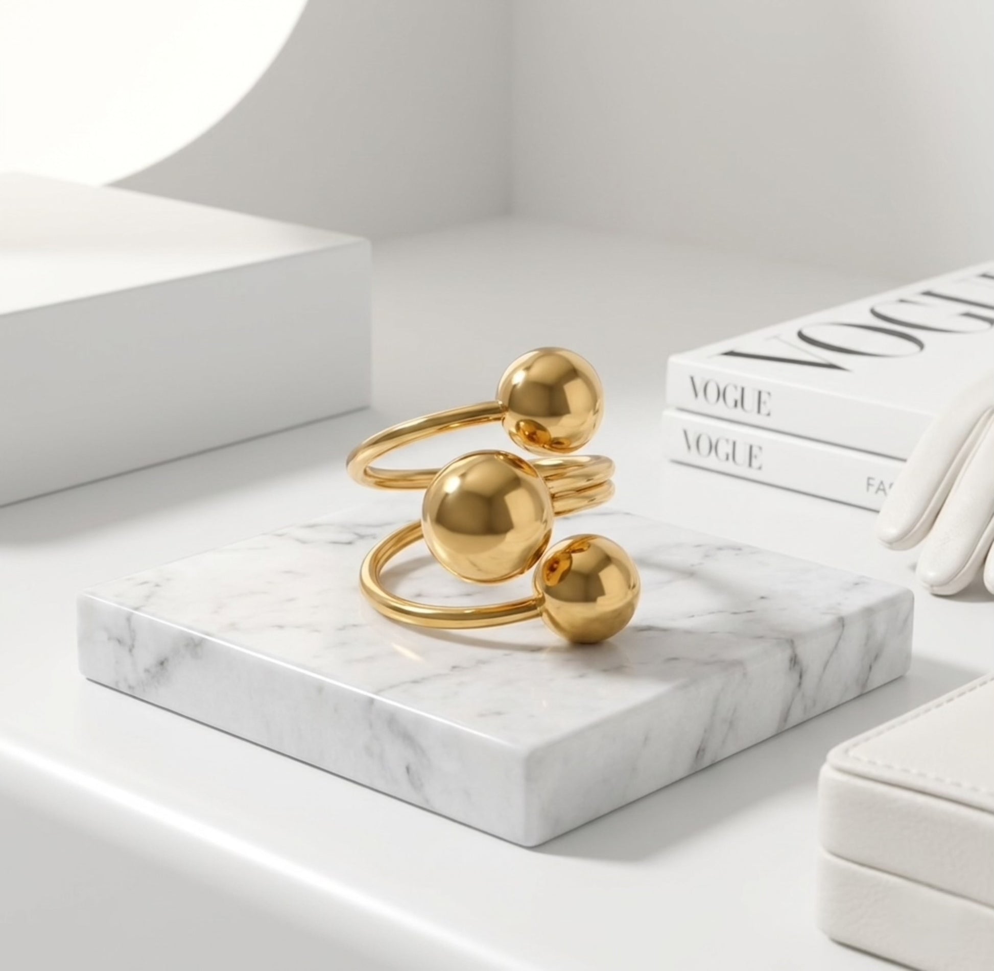 BEHI Mia Ring in gold displayed on a minimal pedestal, showcasing the durable, tarnish-resistant 18k PVD gold plating.