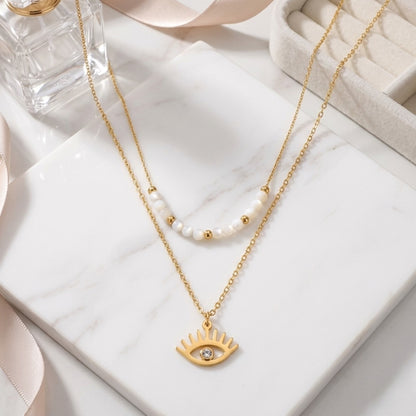 BEHI Viska Necklace | 18k PVD gold-plated stainless steel | layered necklace with white MOP stones and a gold eye pendant with a zircon stone in the center | Waterproof, tarnish-free and hypoallergenic