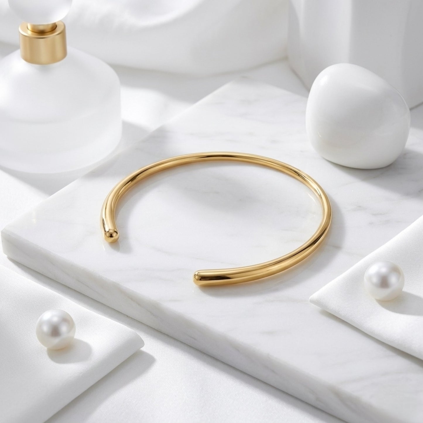 BEHI Flavia Choker in gold displayed on a minimal architectural surface to emphasize its structural form.