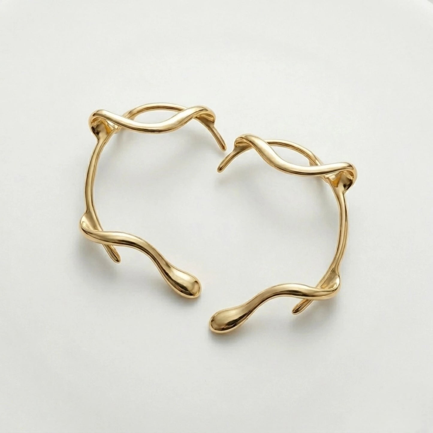 BEHI MILANO Afrodite Ear Cuffs angled view — 18k gold-plated brass wrap ear cuffs, tarnish-free sweatproof no-piercing earrings