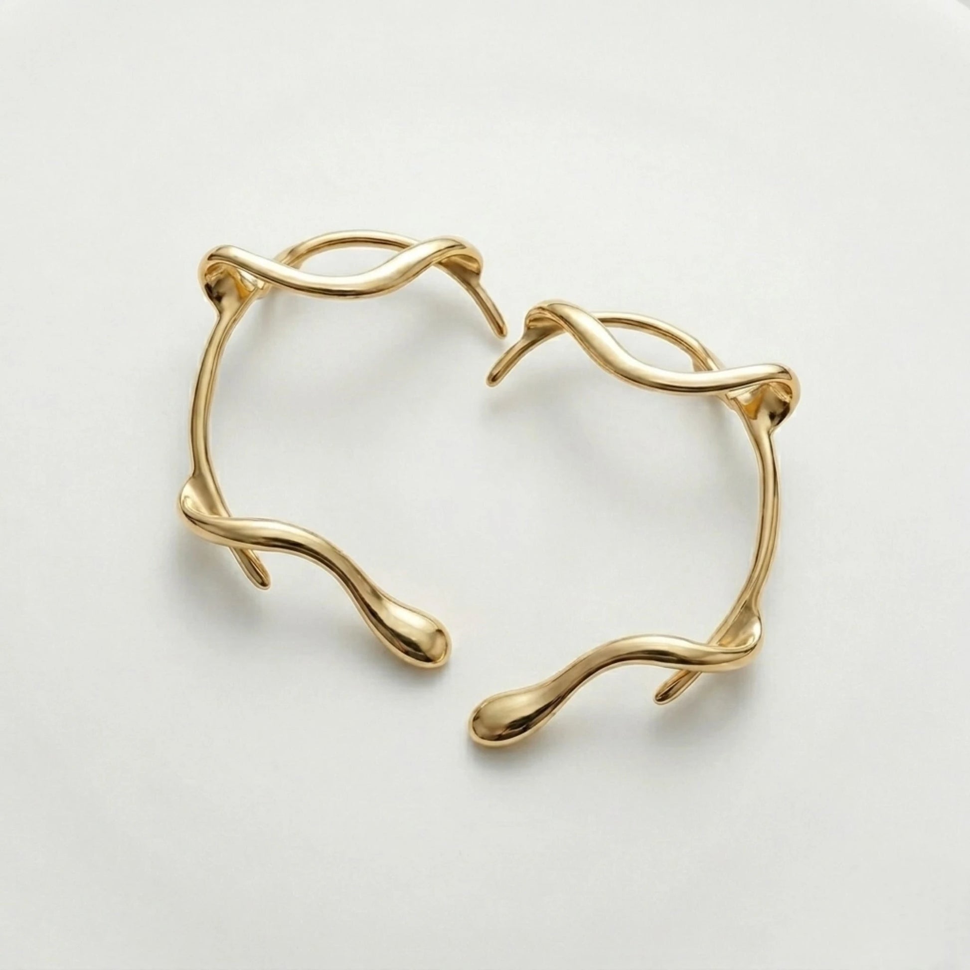 BEHI MILANO Afrodite Ear Cuffs angled view — 18k gold-plated brass wrap ear cuffs, tarnish-free sweatproof no-piercing earrings