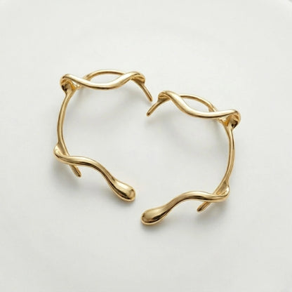 BEHI MILANO Afrodite Ear Cuffs angled view — 18k gold-plated brass wrap ear cuffs, tarnish-free sweatproof no-piercing earrings