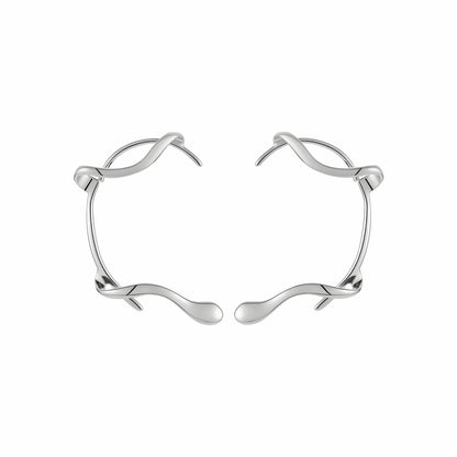 Close-up BEHI MILANO Afrodite Ear Cuffs silver — sculptural wrap shape detail, tarnish-free PVD coating, no-piercing earring