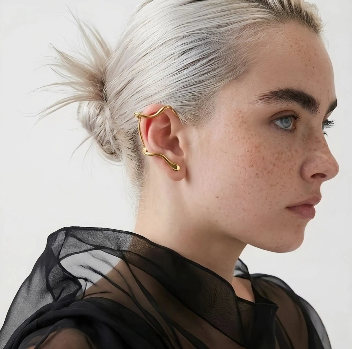 BEHI MILANO Afrodite Ear Cuffs worn on model — sculptural gold wrap ear cuff, no-piercing earring, 18k gold-plated statement jewelry