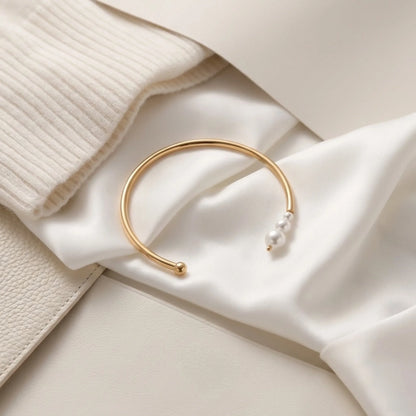 BEHI MILANO Alba Bracelet on cream silk fabric — 18k gold-plated pearl cuff bangle, minimalist open bracelet, waterproof hypoallergenic jewelry