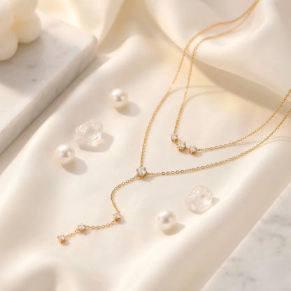 BEHI MILANO Alda Necklace — gold double-layer lariat necklace with zircon bar pendant and cascading Y-drop, 18k gold-plated stainless steel