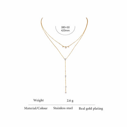 BEHI MILANO Alda Necklace specs — double-layer lariat necklace, chains 380+50mm and 420mm, weight 2.6g, stainless steel with real gold plating