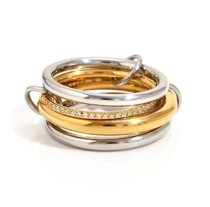 BEHI MILANO Alina Ring — sculptural linked multi-band ring in mixed 18k gold and silver with zircon pavé centre band, waterproof stainless steel