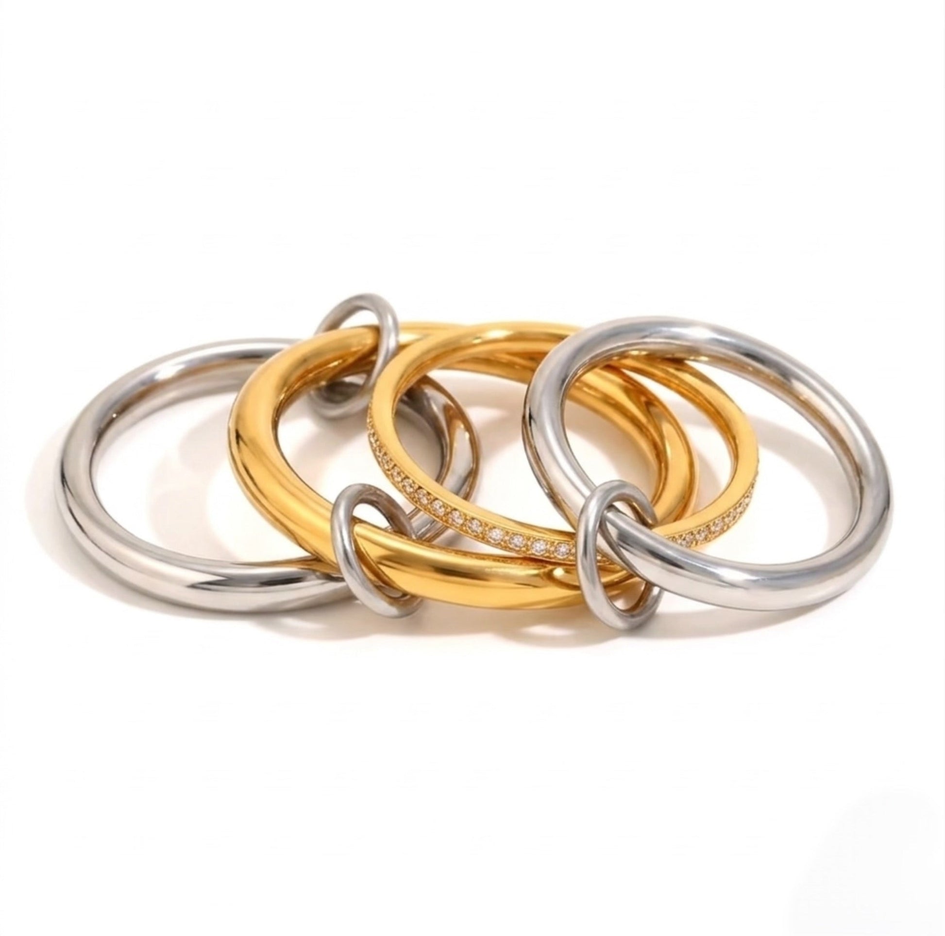 BEHI MILANO Alina Ring spread view — linked gold and silver polished bands with zircon pavé, mixed metal statement ring, 18k gold-plated