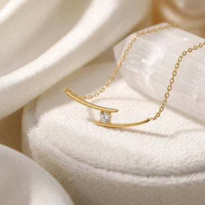 BEHI MILANO Alison Necklace gold detail — sculptural crossed bar pendant with brilliant zircon, PVD 18k gold-plated stainless steel chain