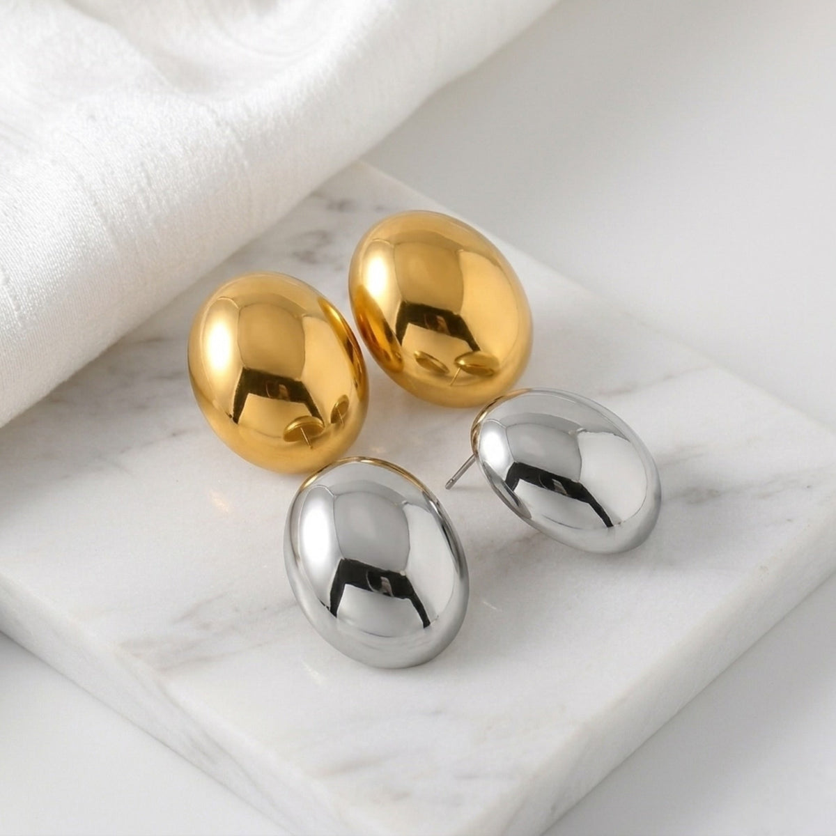 BEHI MILANO Annarita Earrings — gold and silver oversized oval statement studs on marble