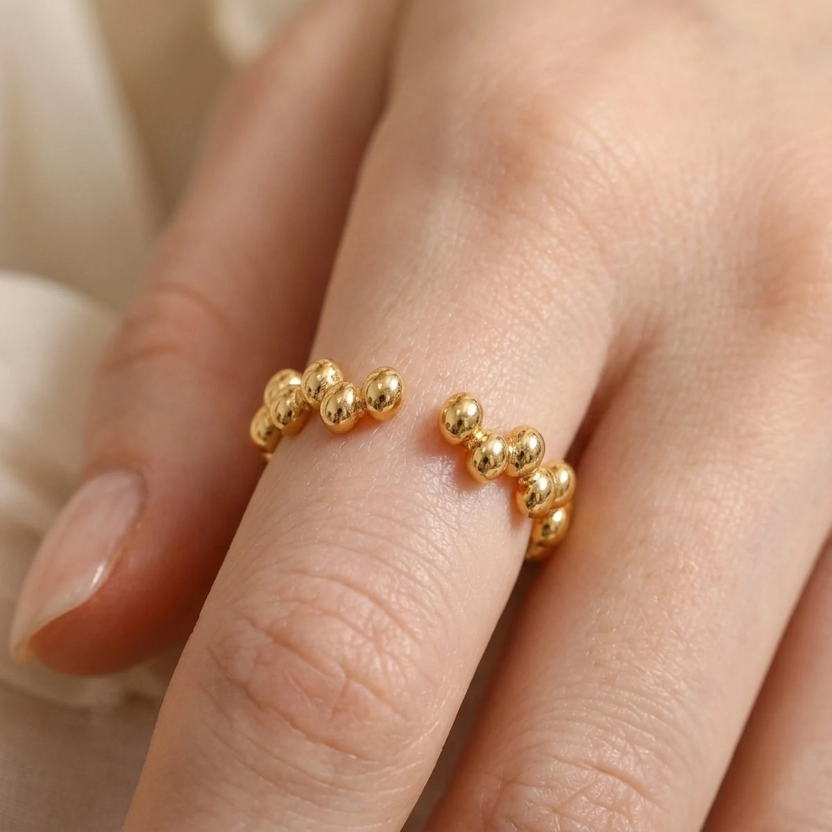 BEHI MILANO Anya Ring — close-up of adjustable beaded open band ring on finger