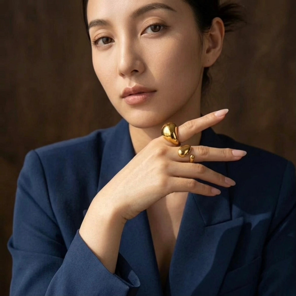BEHI MILANO Archana Ring — portrait of editorial model wearing 18k gold statement ring