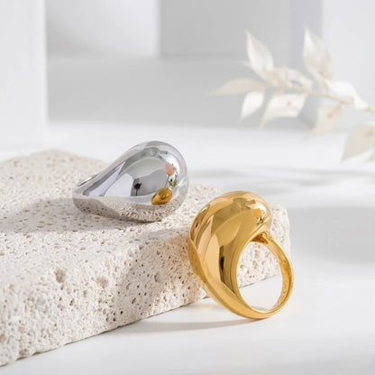 BEHI MILANO Archana Ring — gold and silver sculptural dome rings on natural stone surface