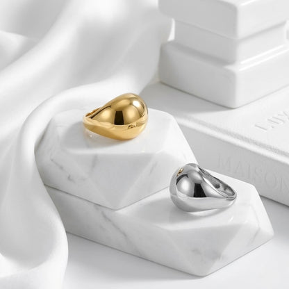 BEHI MILANO Archana Ring — 18k gold and silver statement rings on white display blocks with silk