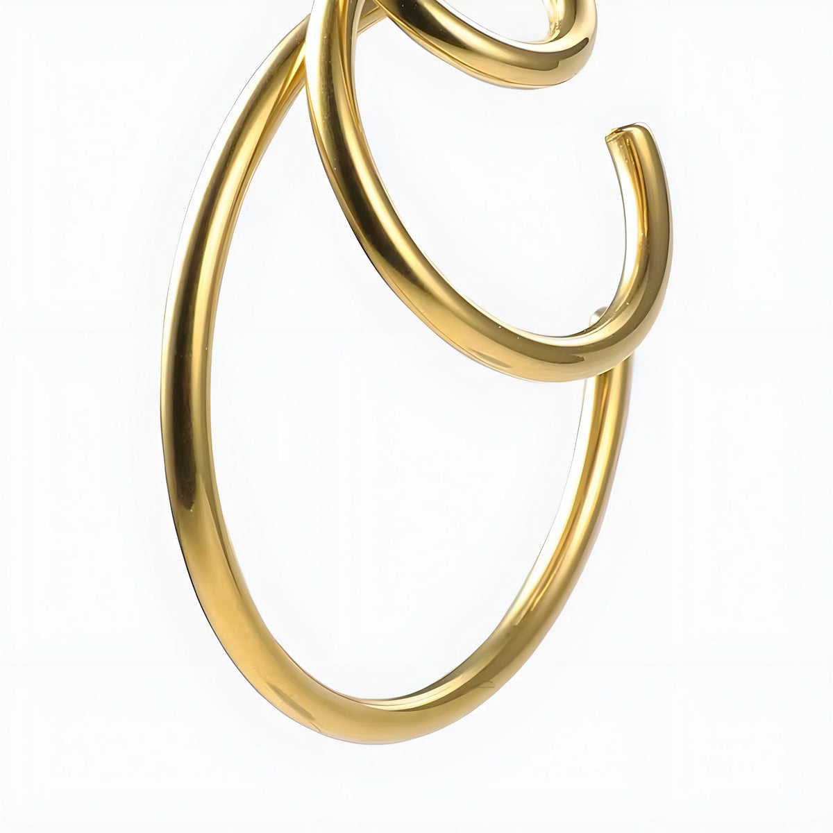 BEHI MILANO Ariel Earrings — close-up view of gold open concentric ring construction
