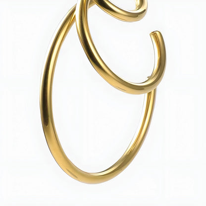 BEHI MILANO Ariel Earrings — close-up view of gold open concentric ring construction
