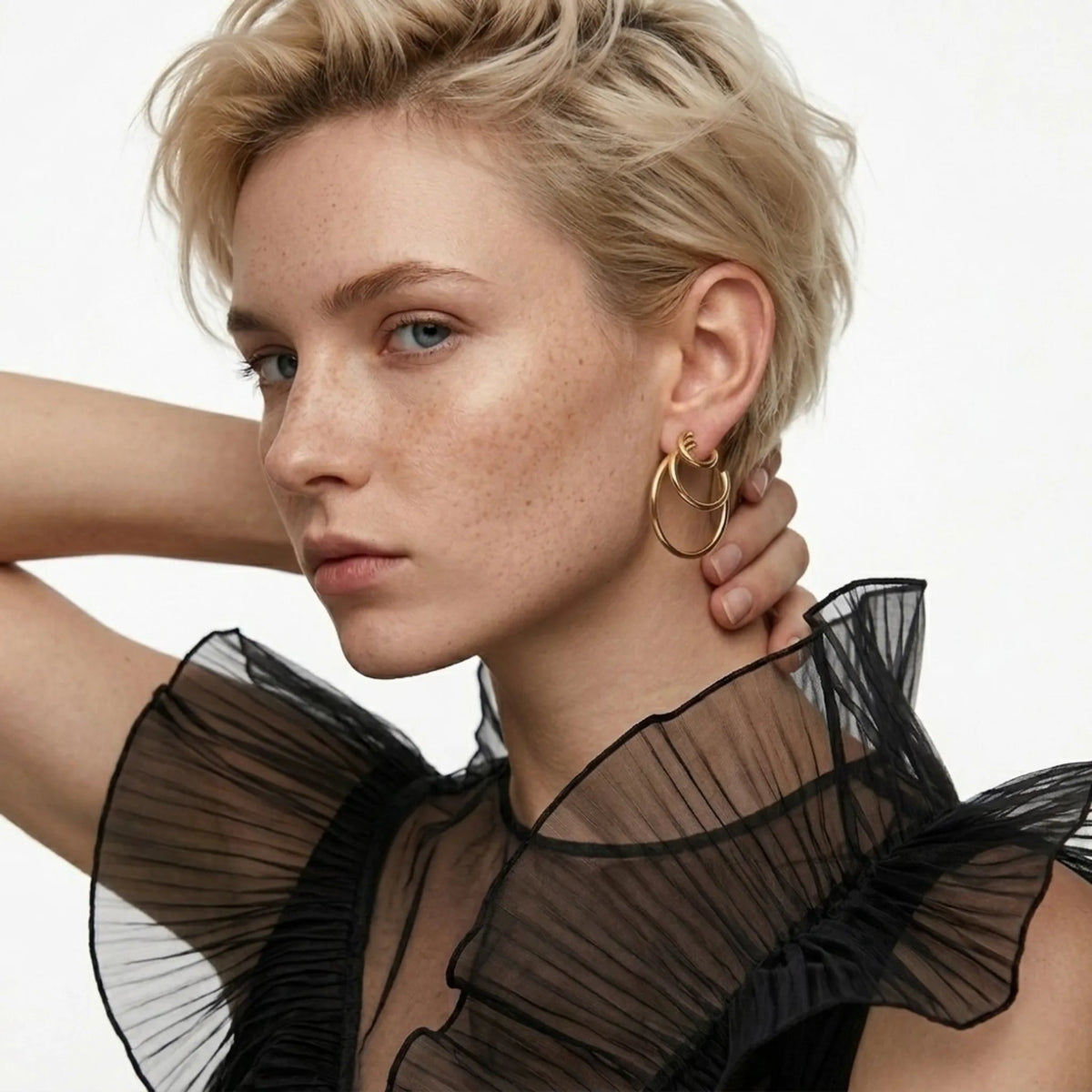BEHI MILANO Ariel Earrings — editorial model wearing 18k gold open ring hoop earrings