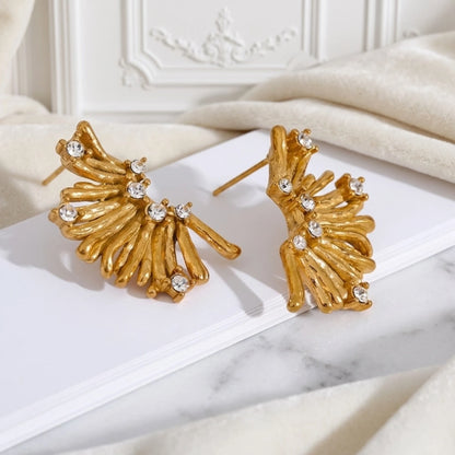 BEHI MILANO Artyman Earrings — 18k gold fan burst earrings on white pedestal display