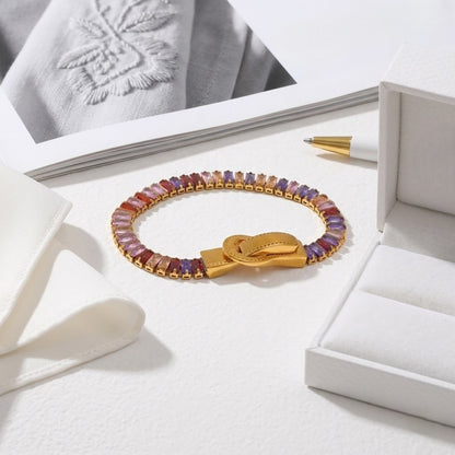 BEHI MILANO Beatrice Bracelet in Multicolor — rainbow gemstone magnetic cuff bracelet on white linen