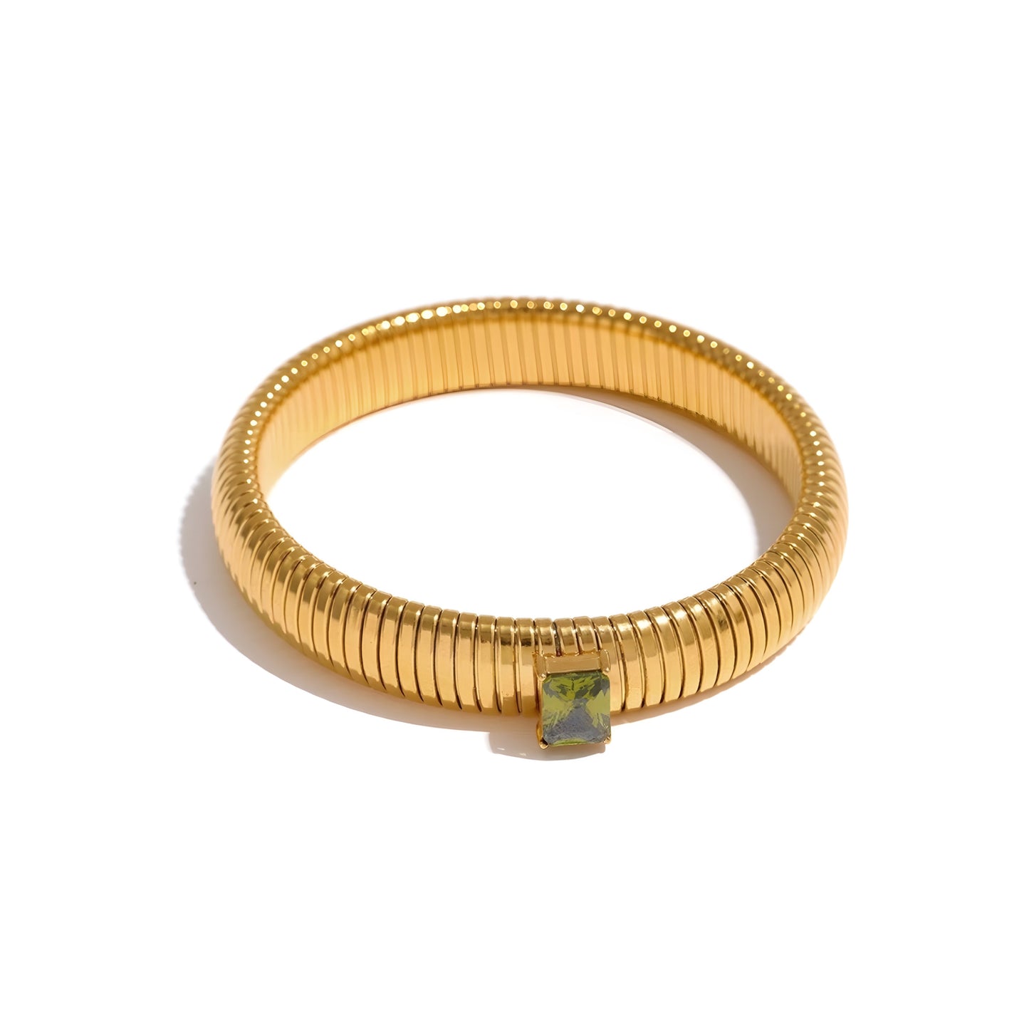 BEHI MILANO Beatriz Bracelet in Green — gold stretch cuff with green emerald-cut cubic zirconia gemstone