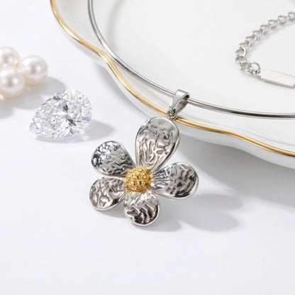 BEHI MILANO Bloom Choker — silver neck wire and two-tone hammered flower pendant on white marble